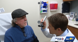 Image of Dr. Molitoris Examining Patient